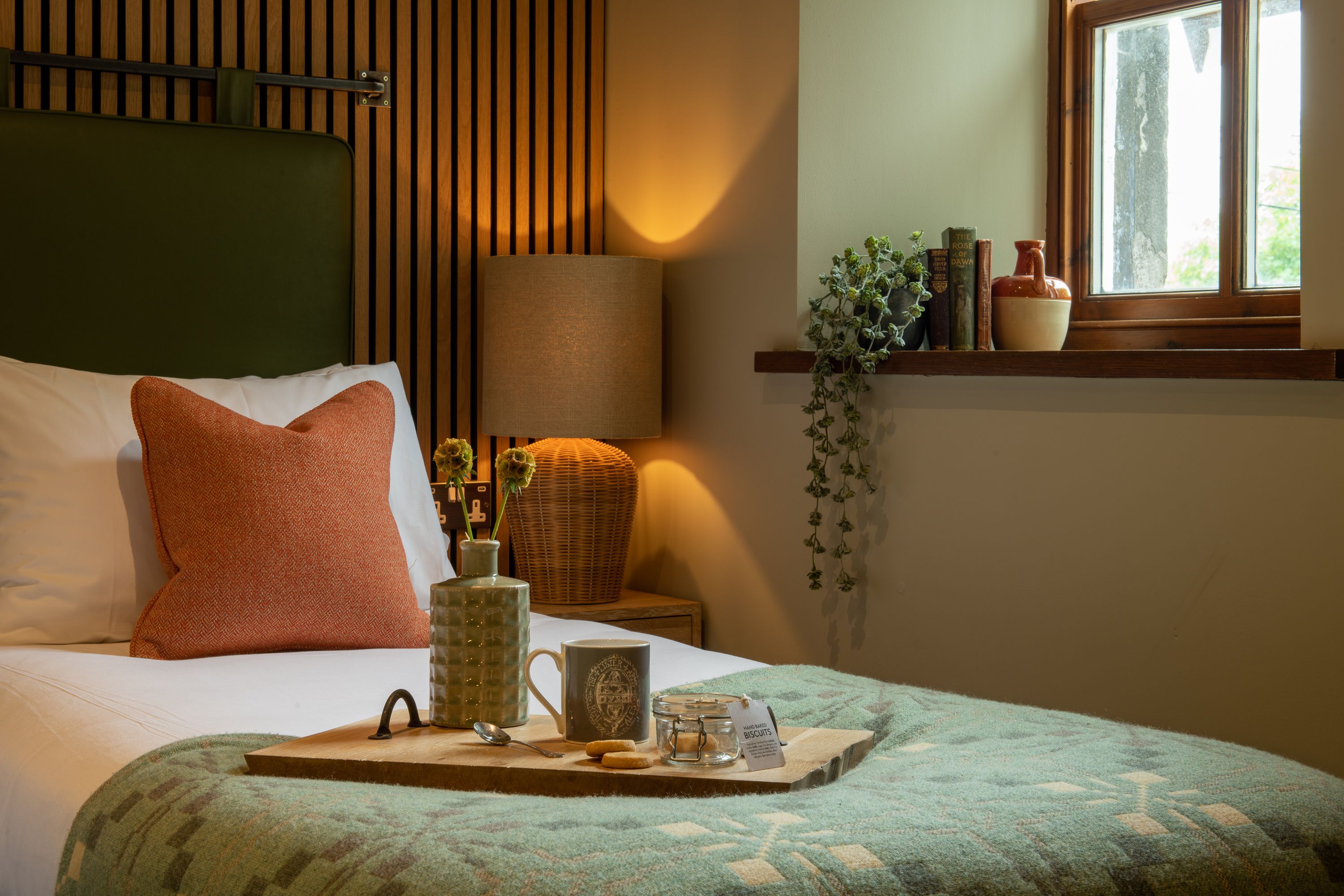 Single bed with coffee tray and cookies