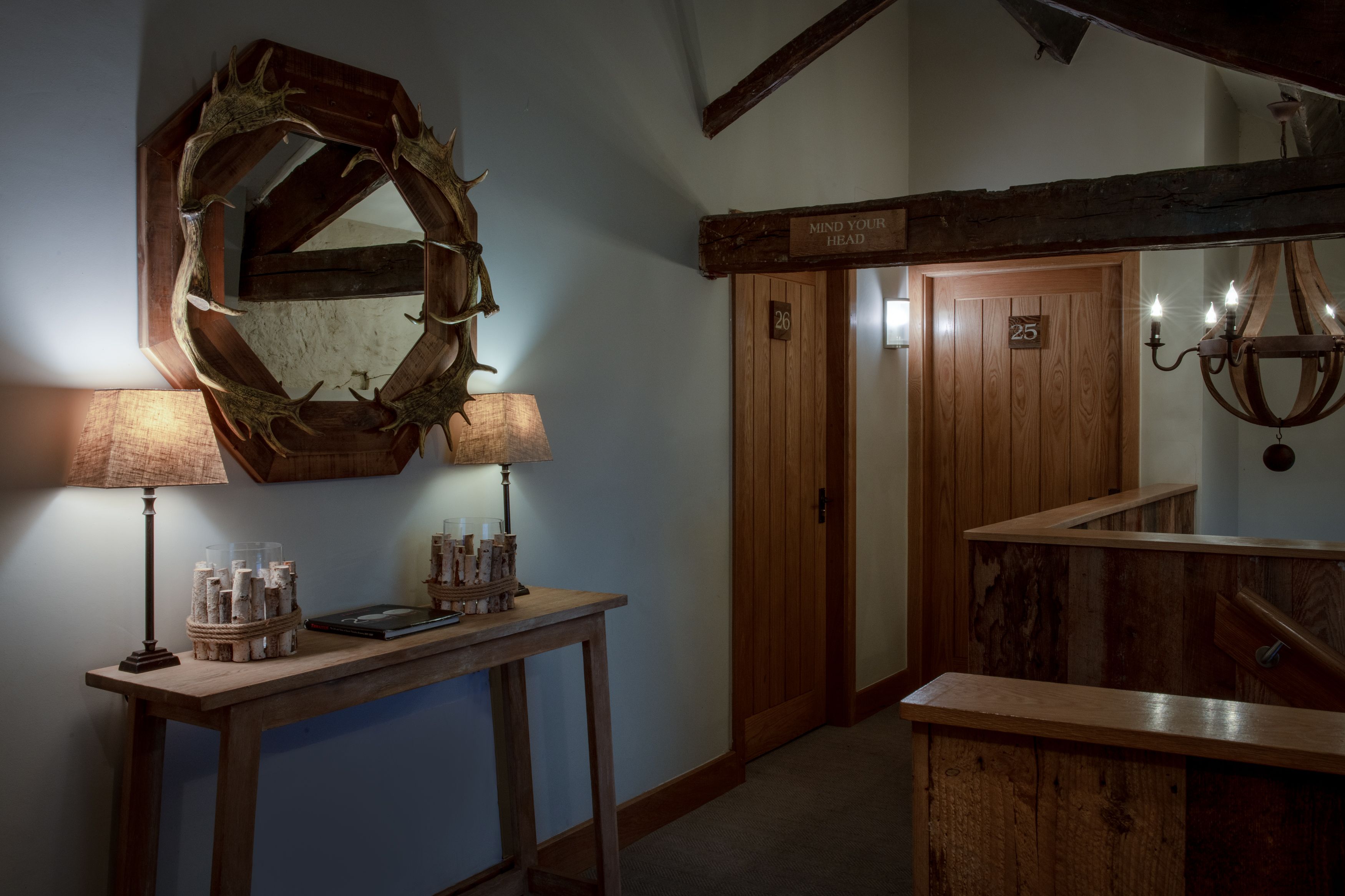 hallway with console table and room numbers