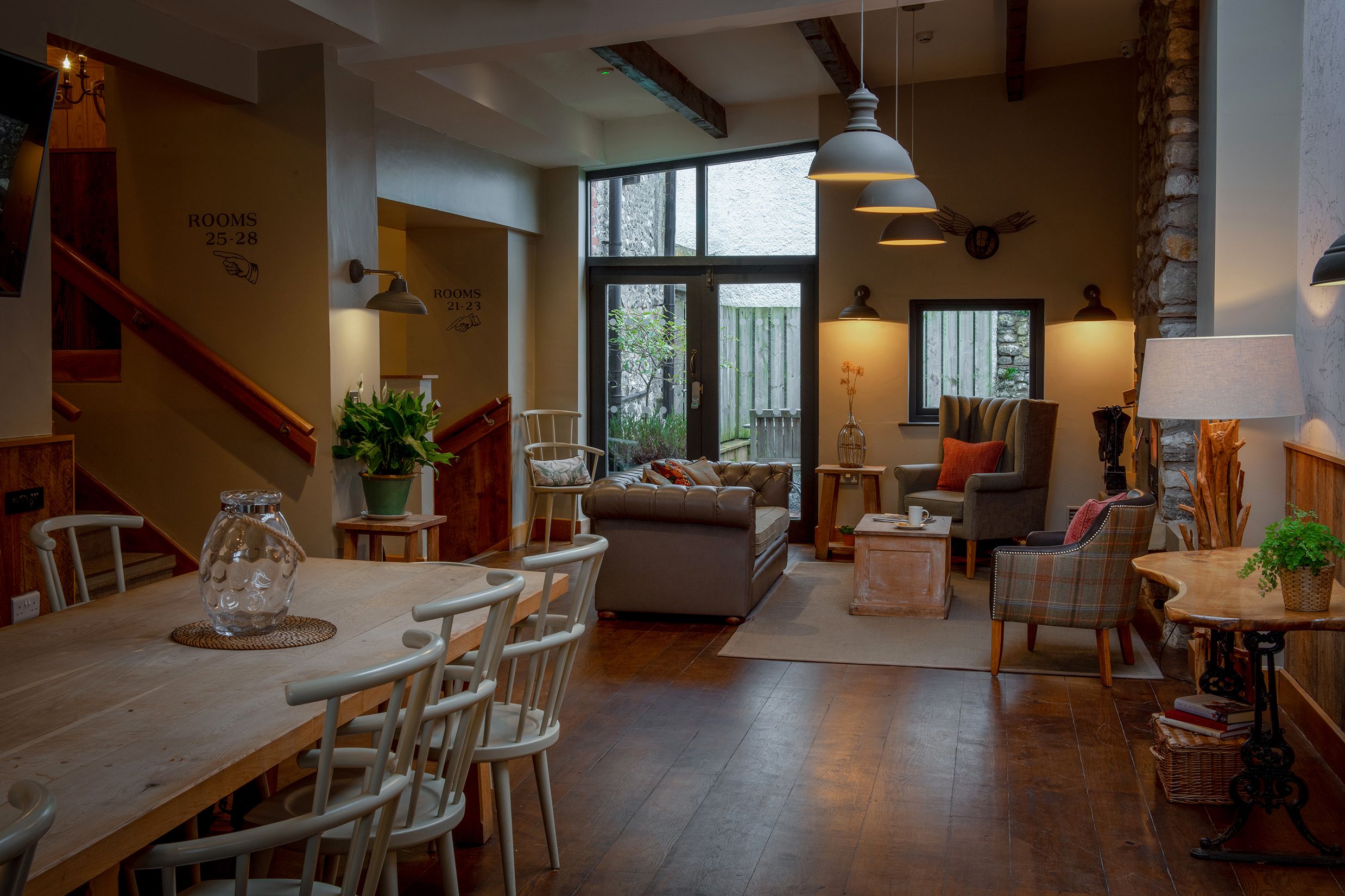 barn lounge area with sofas and dining table