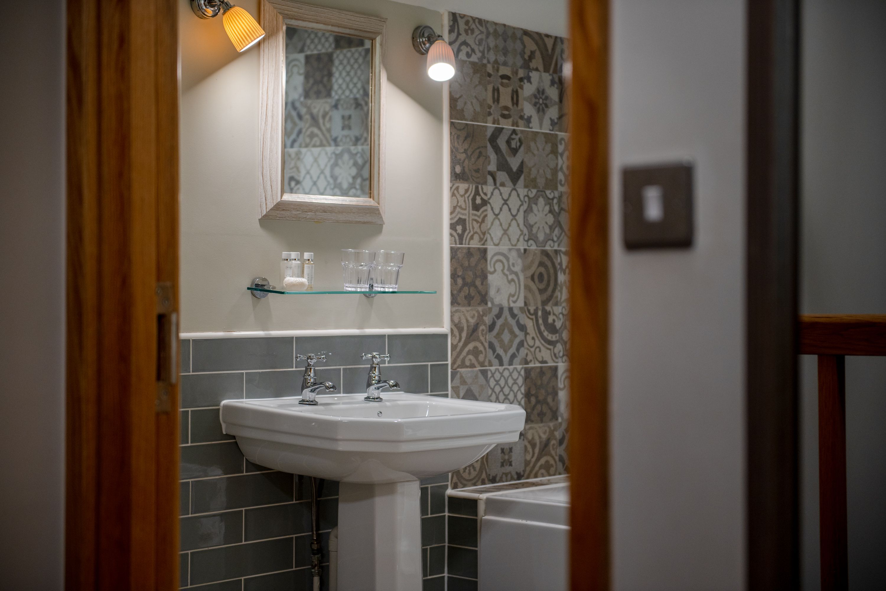 shot of bathroom sink through door