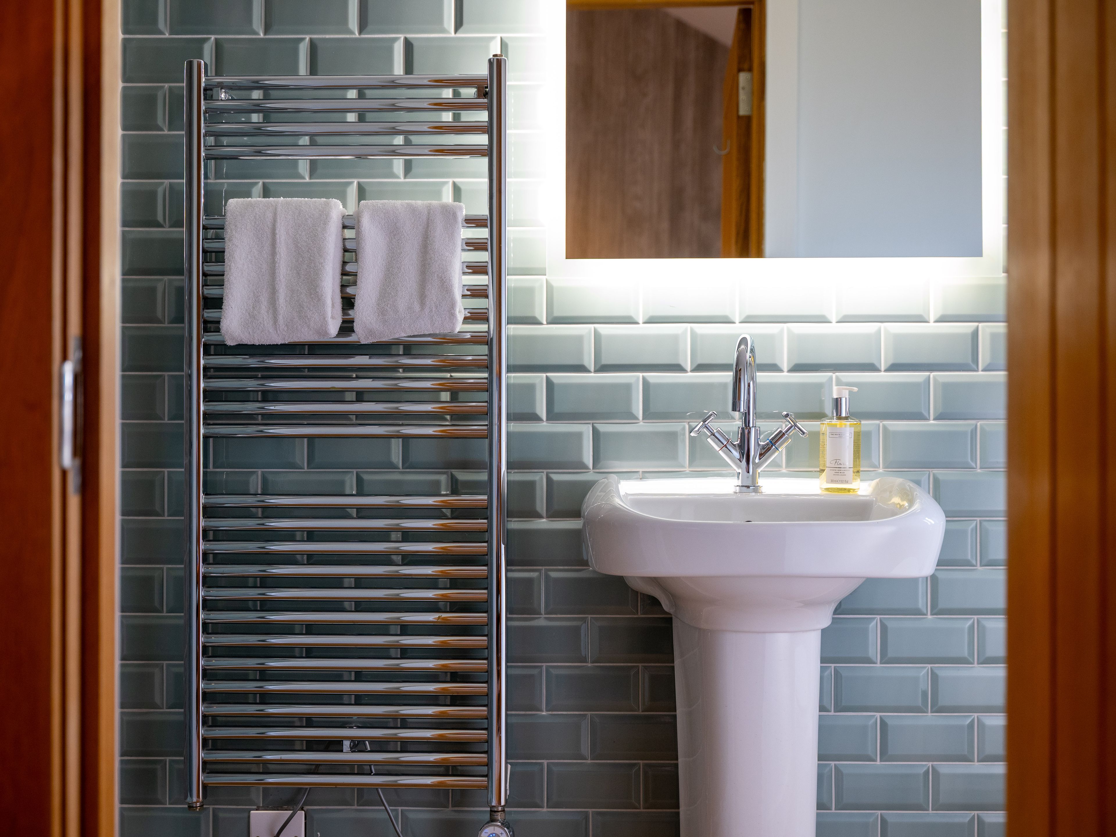 Character bathroom with blue tiles and sink